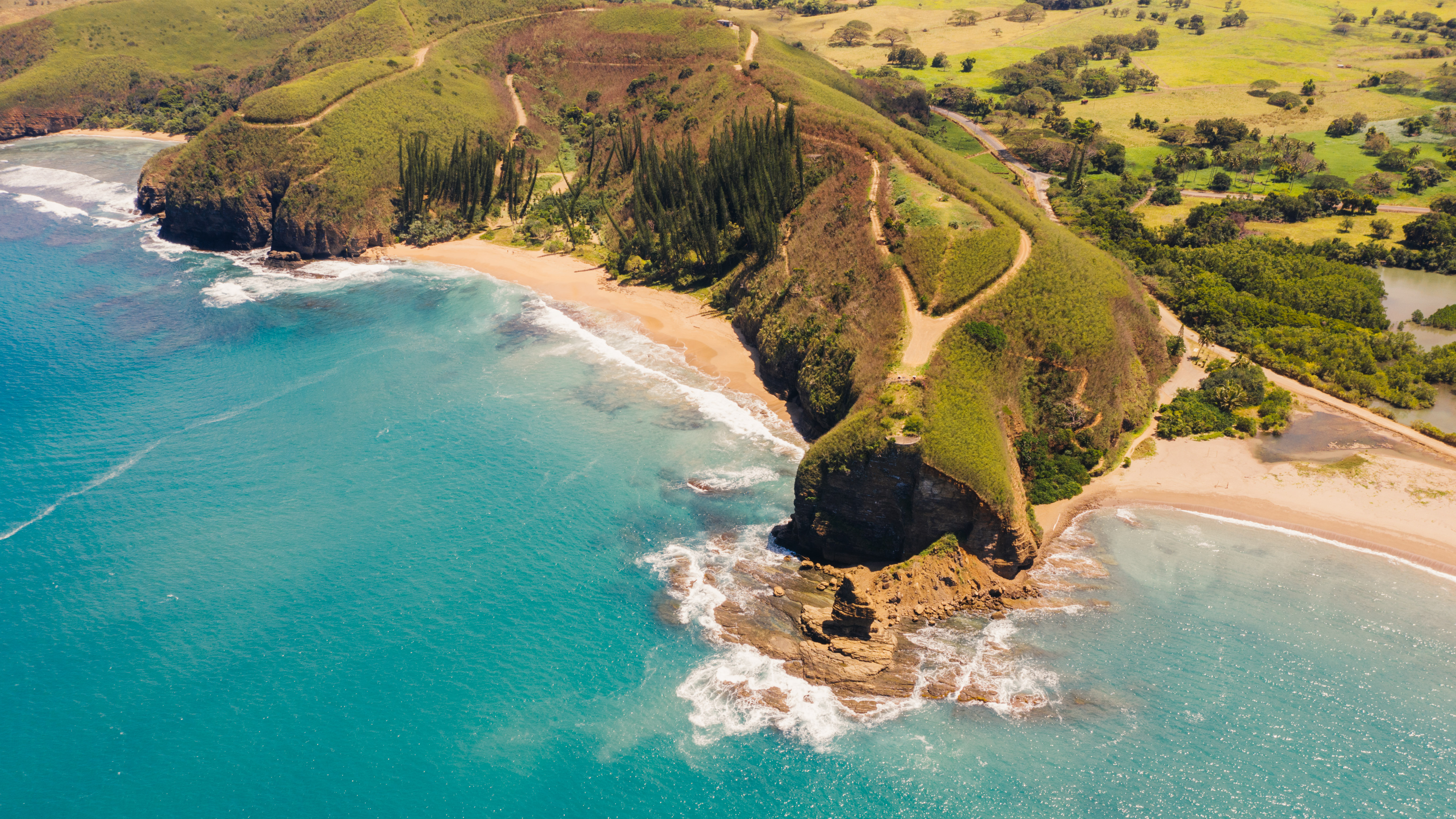 aerial view of cliff edge along coastline