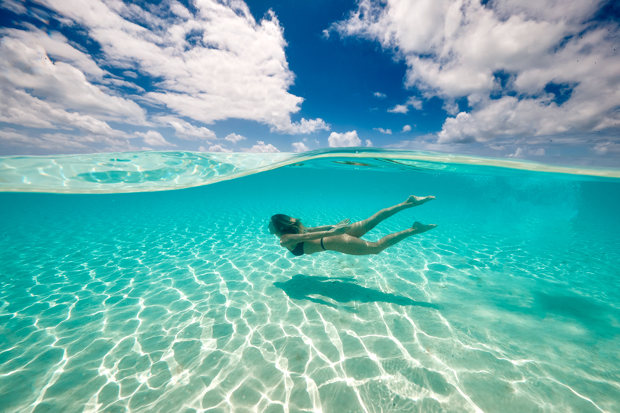 girl swimming in aqua water